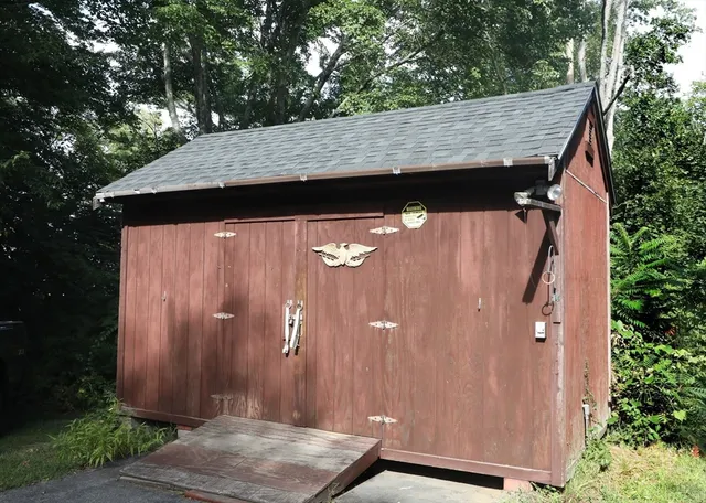 a view of a chair and table in the garden