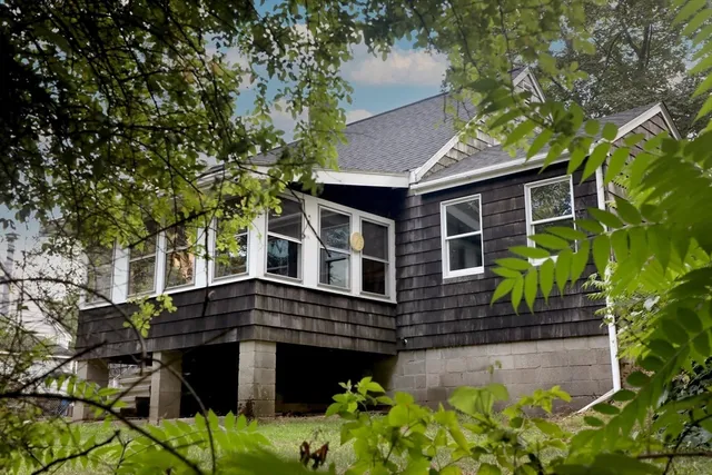 a front view of a house with garden