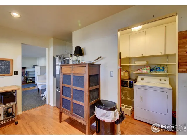 a living room with a furniture and a fireplace