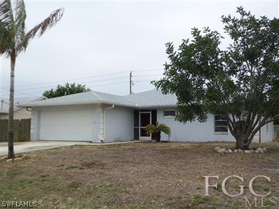 8376 Matanzas Road Fort Myers, FL 33967 - Photo 1 of 10 a view of a house with a yard