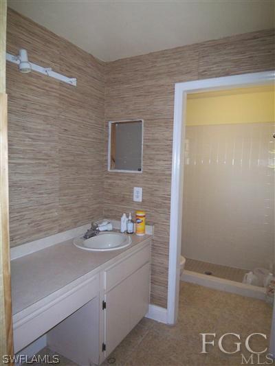 8376 Matanzas Road Fort Myers, FL 33967 - Photo 6 of 10 a bathroom with a sink and a shower