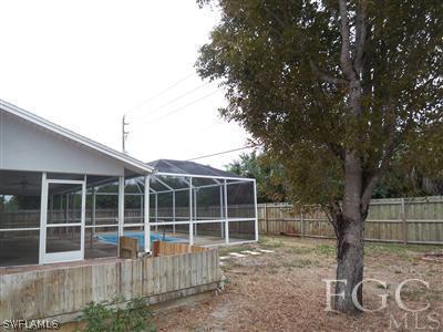 8376 Matanzas Road Fort Myers, FL 33967 - Photo 10 of 10 a view of an house with backyard space and garden