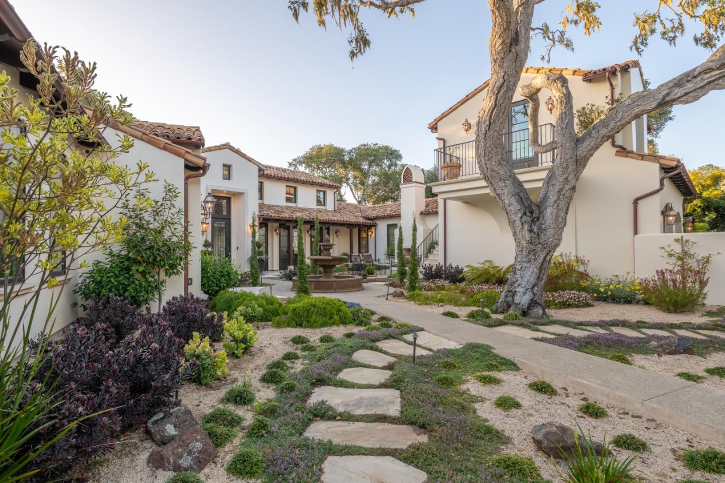 a front view of a house with garden