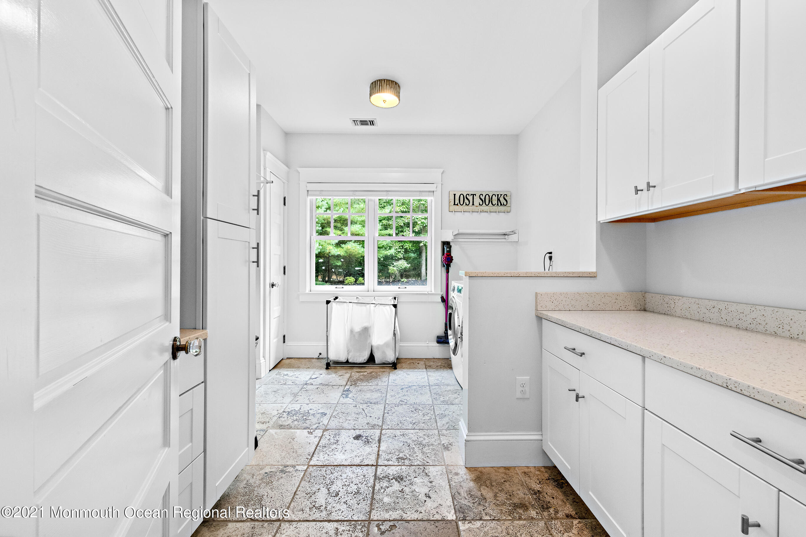 43 Muhlenbrink Road Colts Neck, NJ 07722 - Photo 36 of 89 a kitchen with a refrigerator a stove a washer and dryer