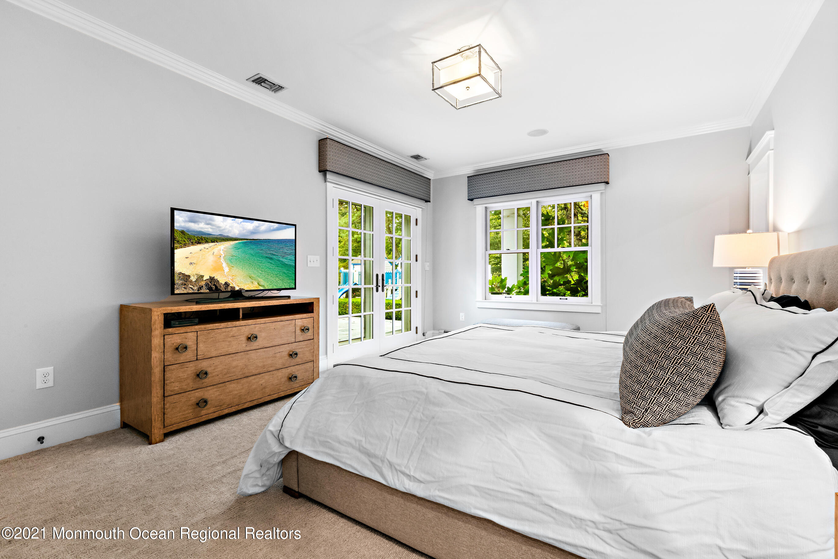 43 Muhlenbrink Road Colts Neck, NJ 07722 - Photo 40 of 89 a bedroom with a bed and a flat screen tv