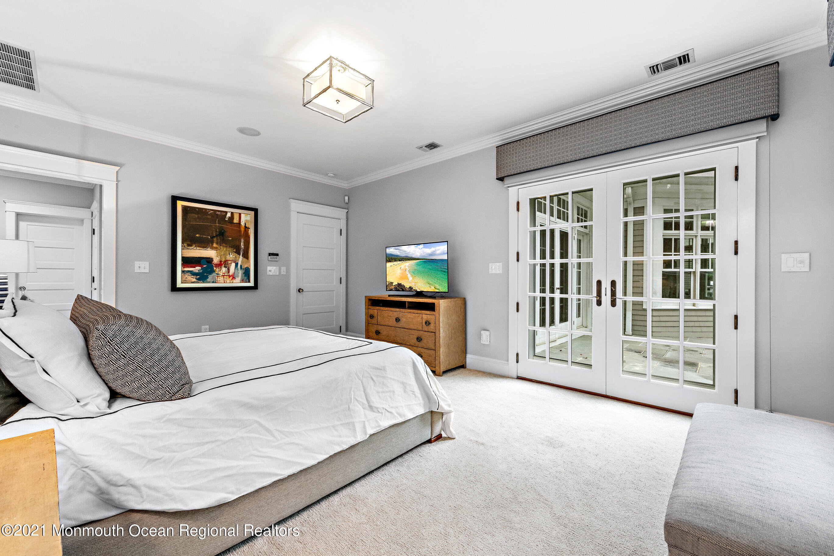 43 Muhlenbrink Road Colts Neck, NJ 07722 - Photo 41 of 89 a bedroom with a large bed and a tv