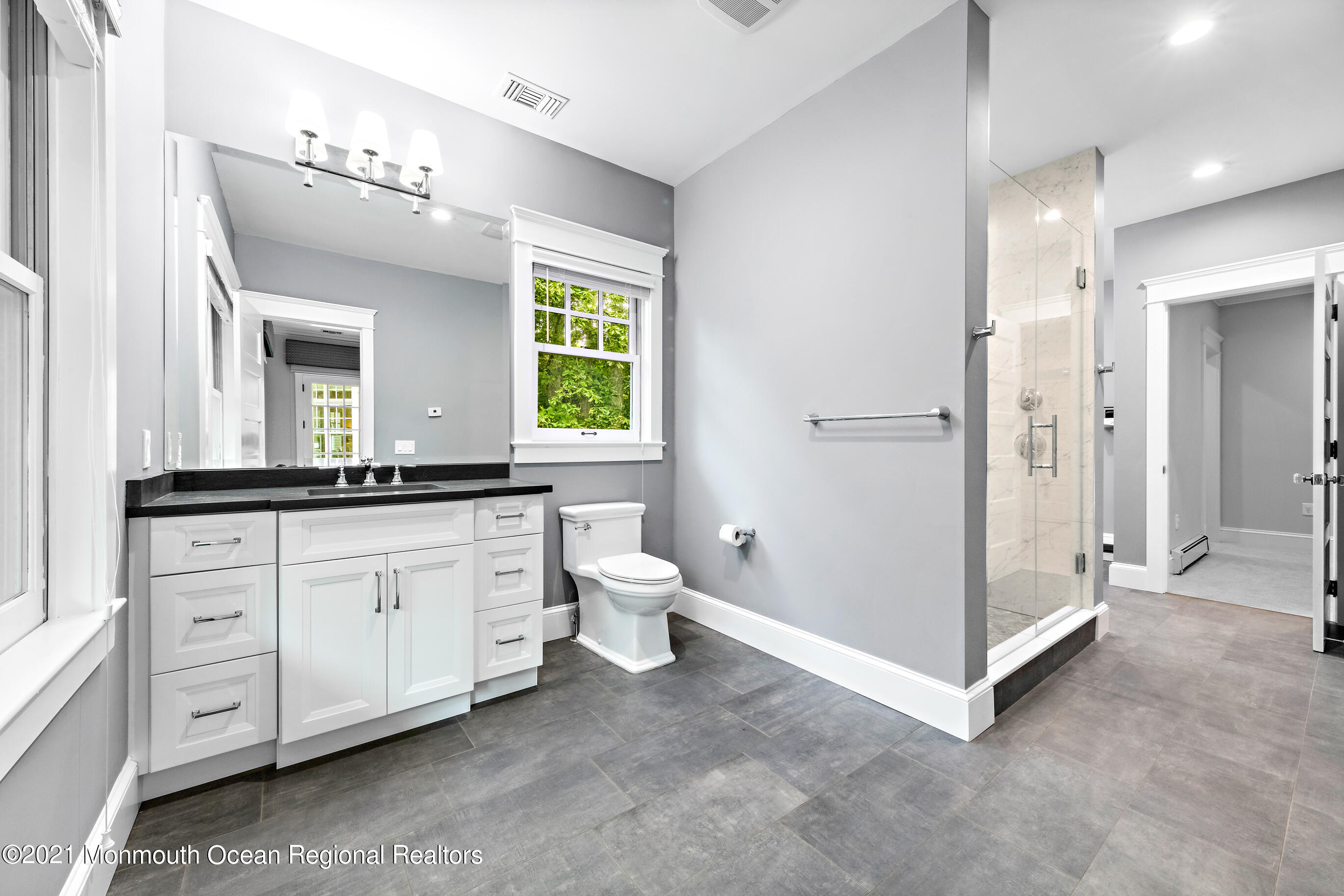 43 Muhlenbrink Road Colts Neck, NJ 07722 - Photo 42 of 89 a spacious bathroom with a double vanity sink a toilet and a mirror