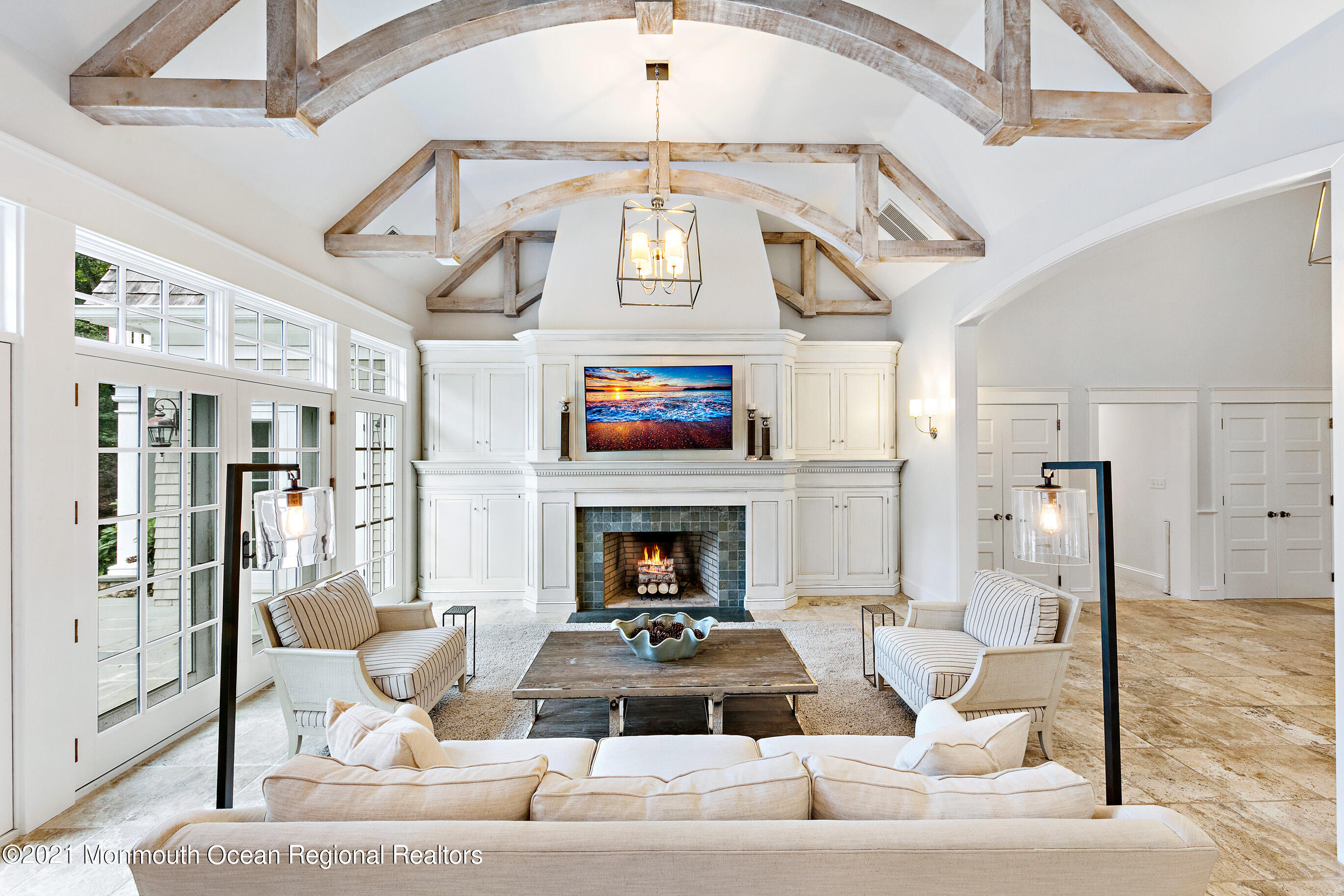 43 Muhlenbrink Road Colts Neck, NJ 07722 - Photo 8 of 89 a living room with furniture a fireplace and a chandelier