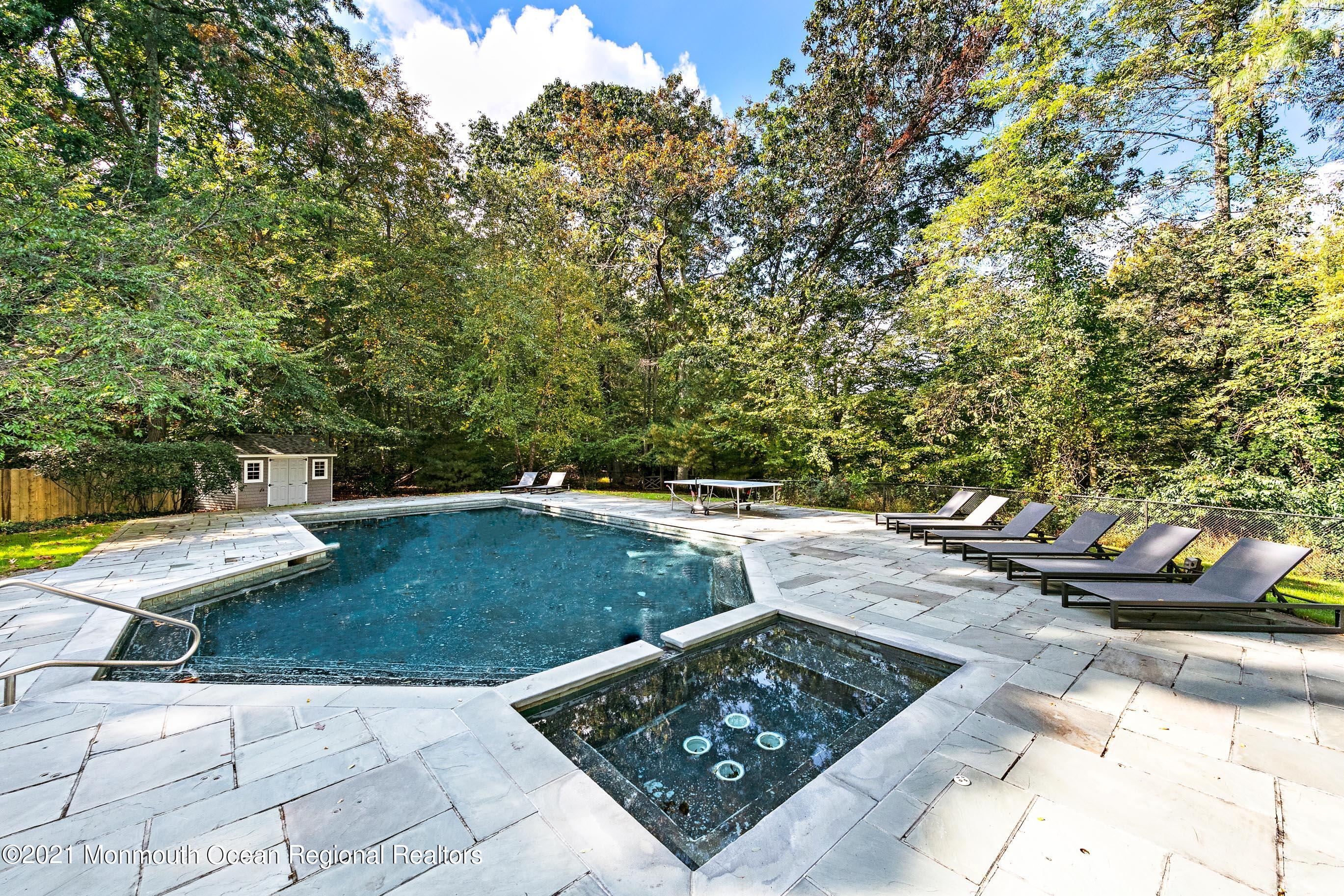 43 Muhlenbrink Road Colts Neck, NJ 07722 - Photo 71 of 89 a view of a backyard with chairs and potted plants