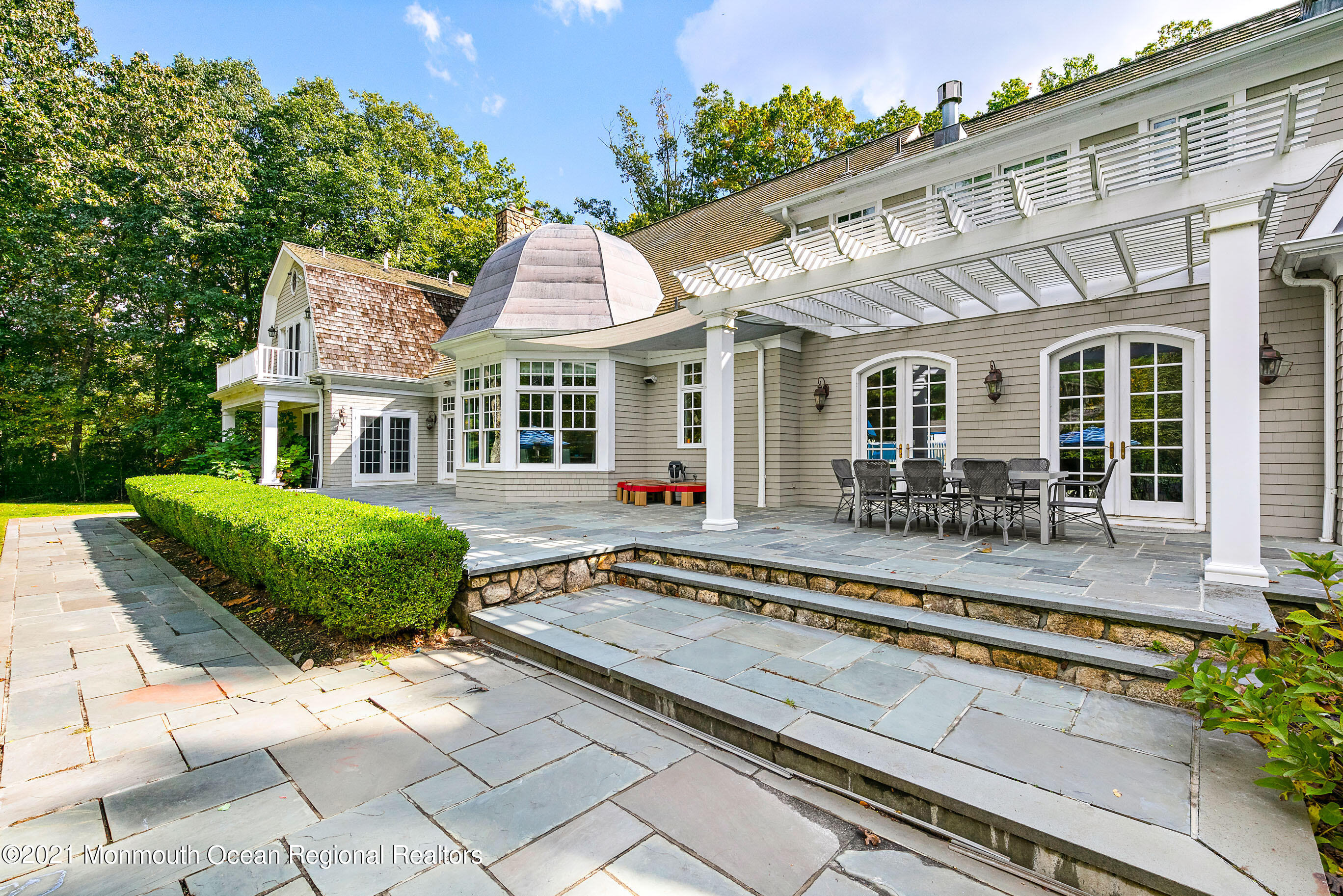 43 Muhlenbrink Road Colts Neck, NJ 07722 - Photo 73 of 89 a view of a house with a backyard porch and sitting area