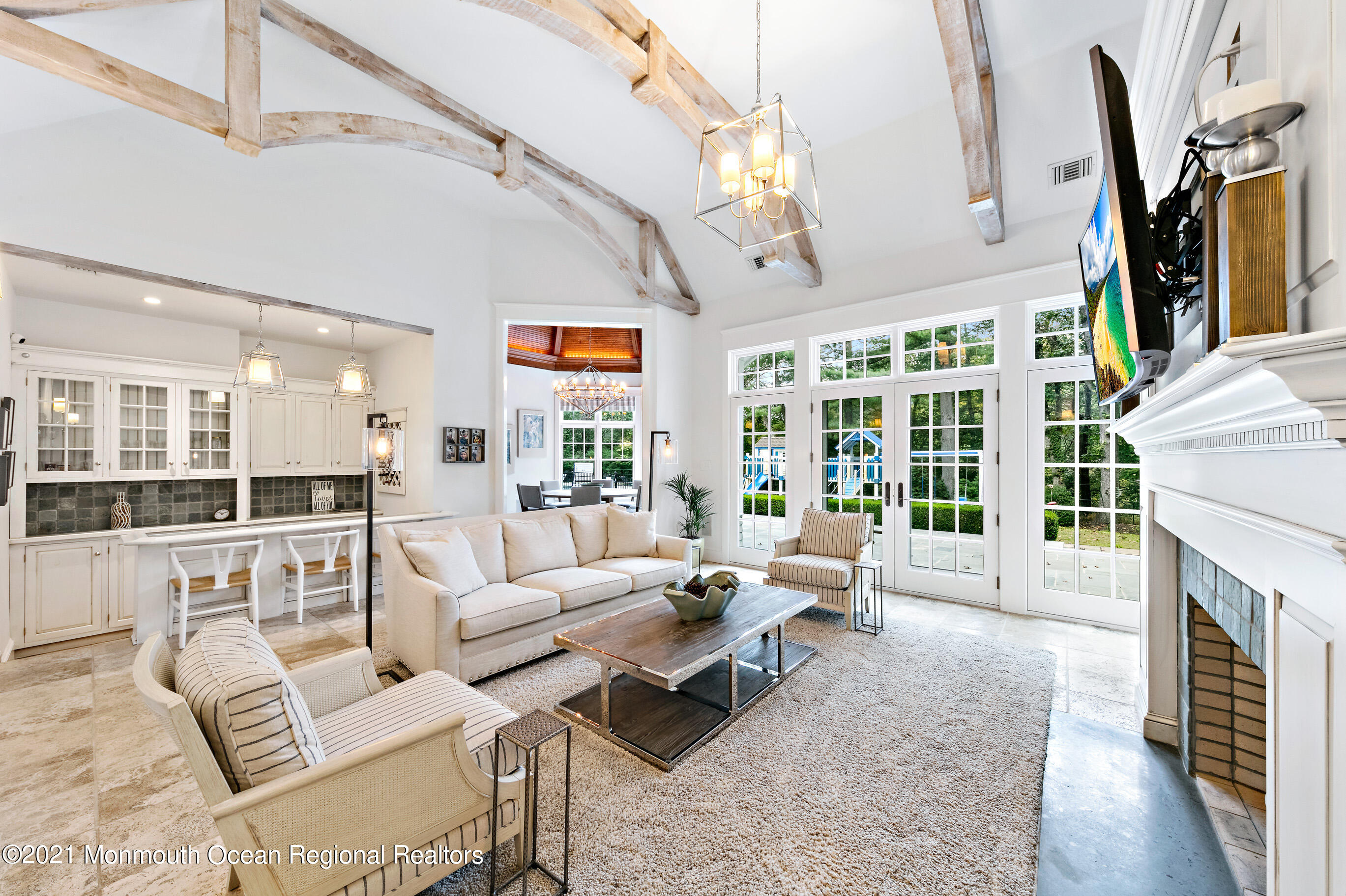 43 Muhlenbrink Road Colts Neck, NJ 07722 - Photo 9 of 89 a living room with furniture fireplace and flat screen tv