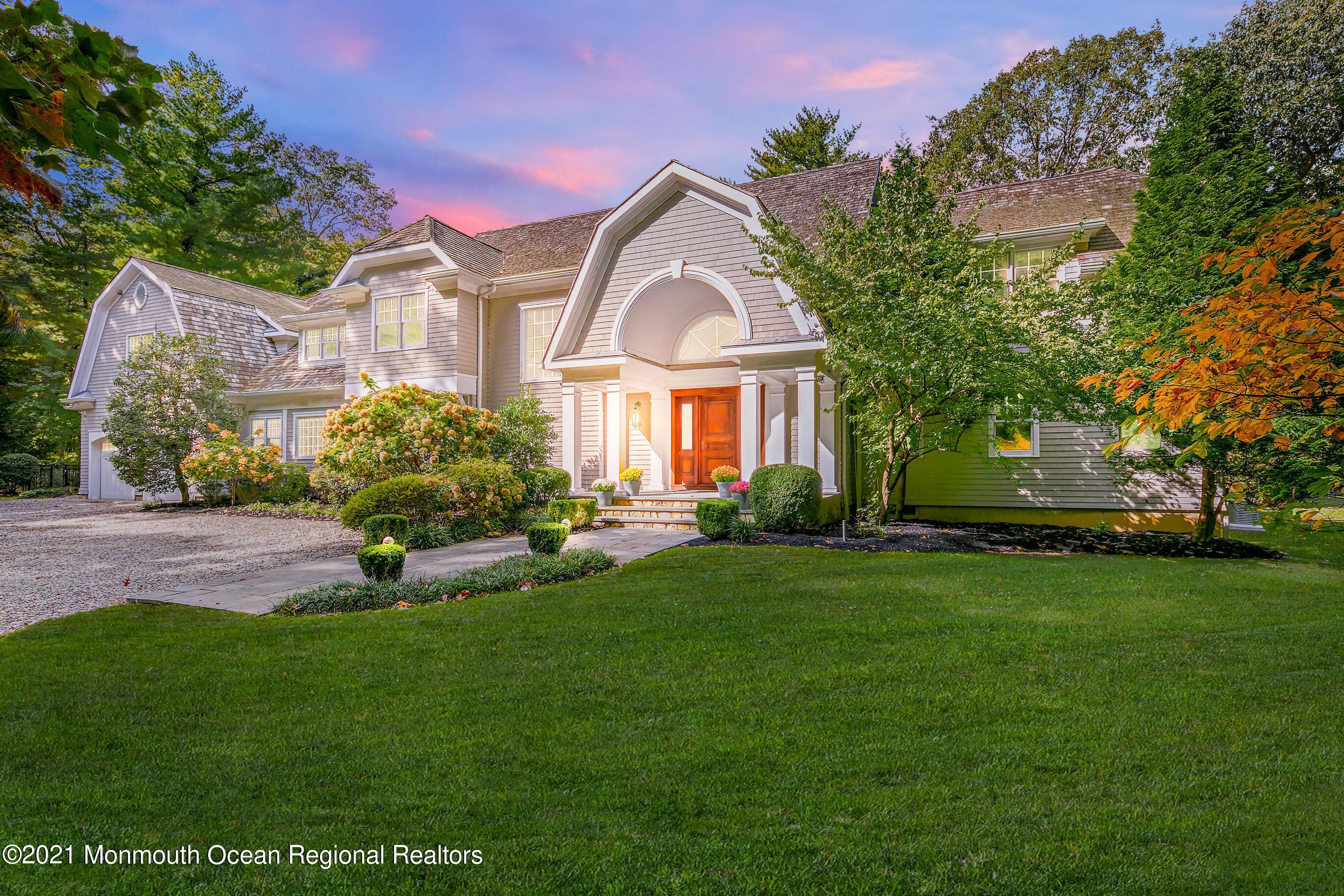 43 Muhlenbrink Road Colts Neck, NJ 07722 - Photo 87 of 89 a front view of a house with a garden and plants