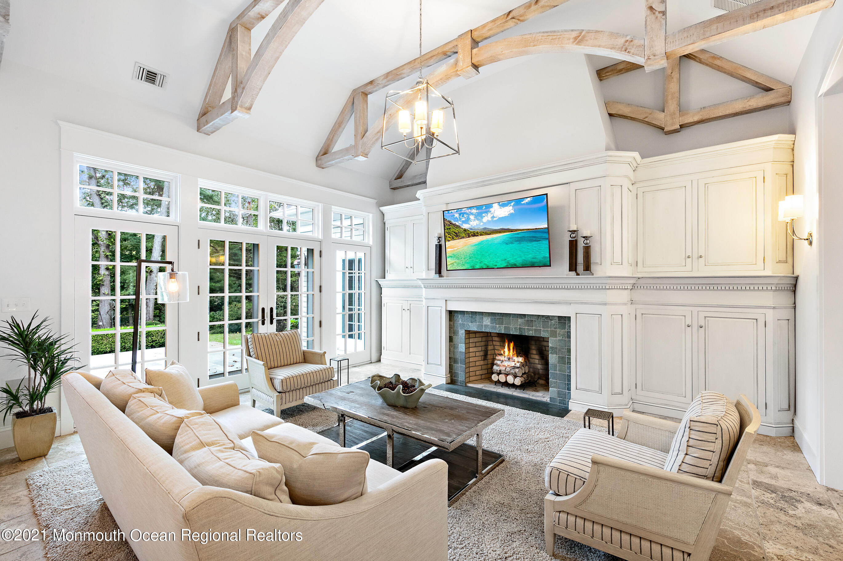 43 Muhlenbrink Road Colts Neck, NJ 07722 - Photo 10 of 89 a living room with furniture a fireplace and a window
