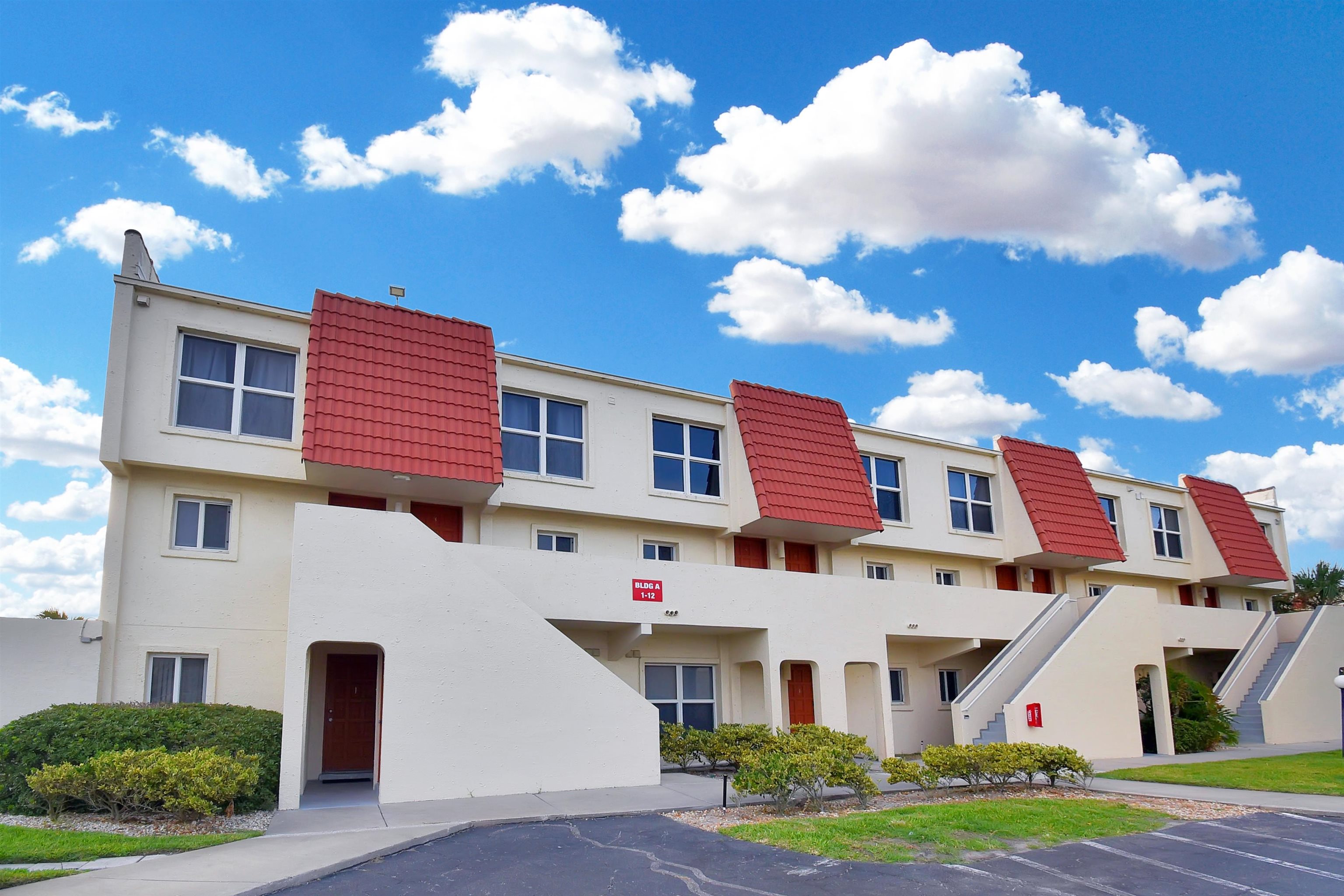 390 A1A Beach Boulevard, Unit 4 St. Augustine Beach, FL 32080 - Photo 22 of 34 a front view of a multi story residential apartment building with yard