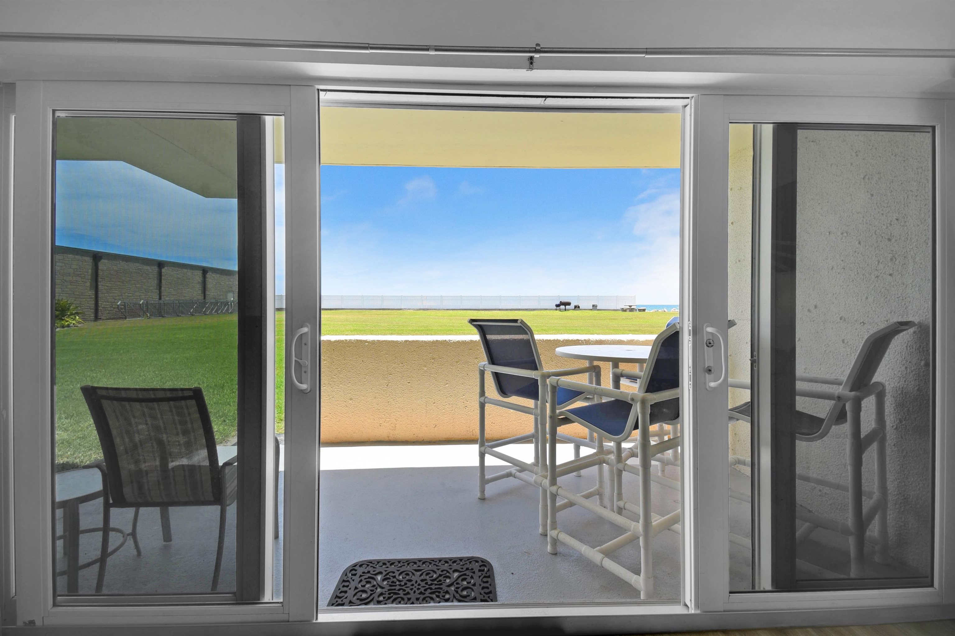 390 A1A Beach Boulevard, Unit 4 St. Augustine Beach, FL 32080 - Photo 31 of 34 a view of a dining room with a table and chairs