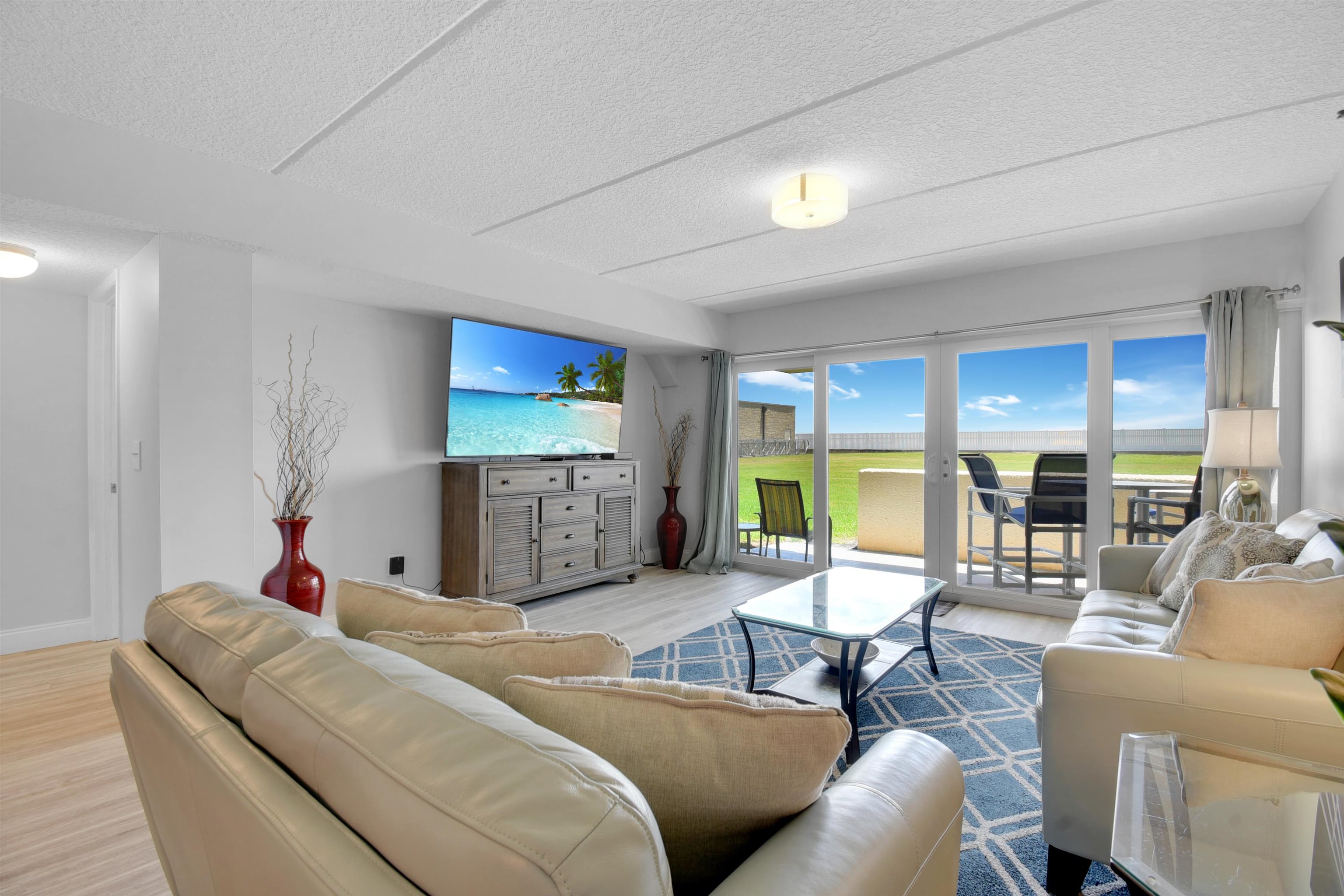 390 A1A Beach Boulevard, Unit 4 St. Augustine Beach, FL 32080 - Photo 7 of 34 a living room with furniture kitchen view and a large window
