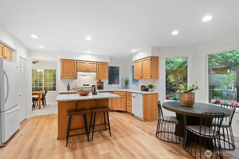 a view of a dining room with furniture window and wooden floor