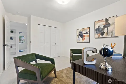 a living room with furniture and next to a window