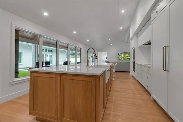 an open kitchen with a table and chairs