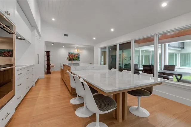 a living room with furniture wooden floor and a fireplace