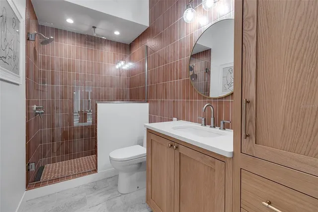 a bedroom with a bed and painting on the wall