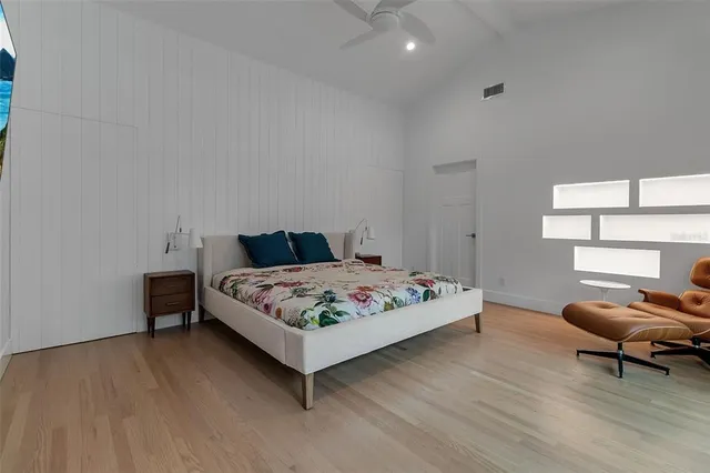 a bedroom with bed and window