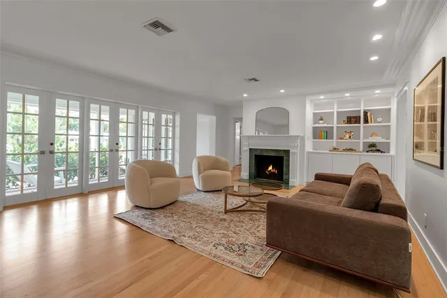 a view of a dining room with furniture wooden floor and chandelier