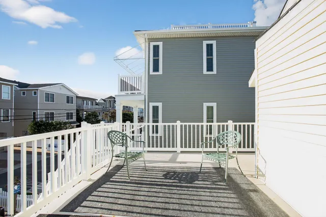 a view of a chair and table on the deck