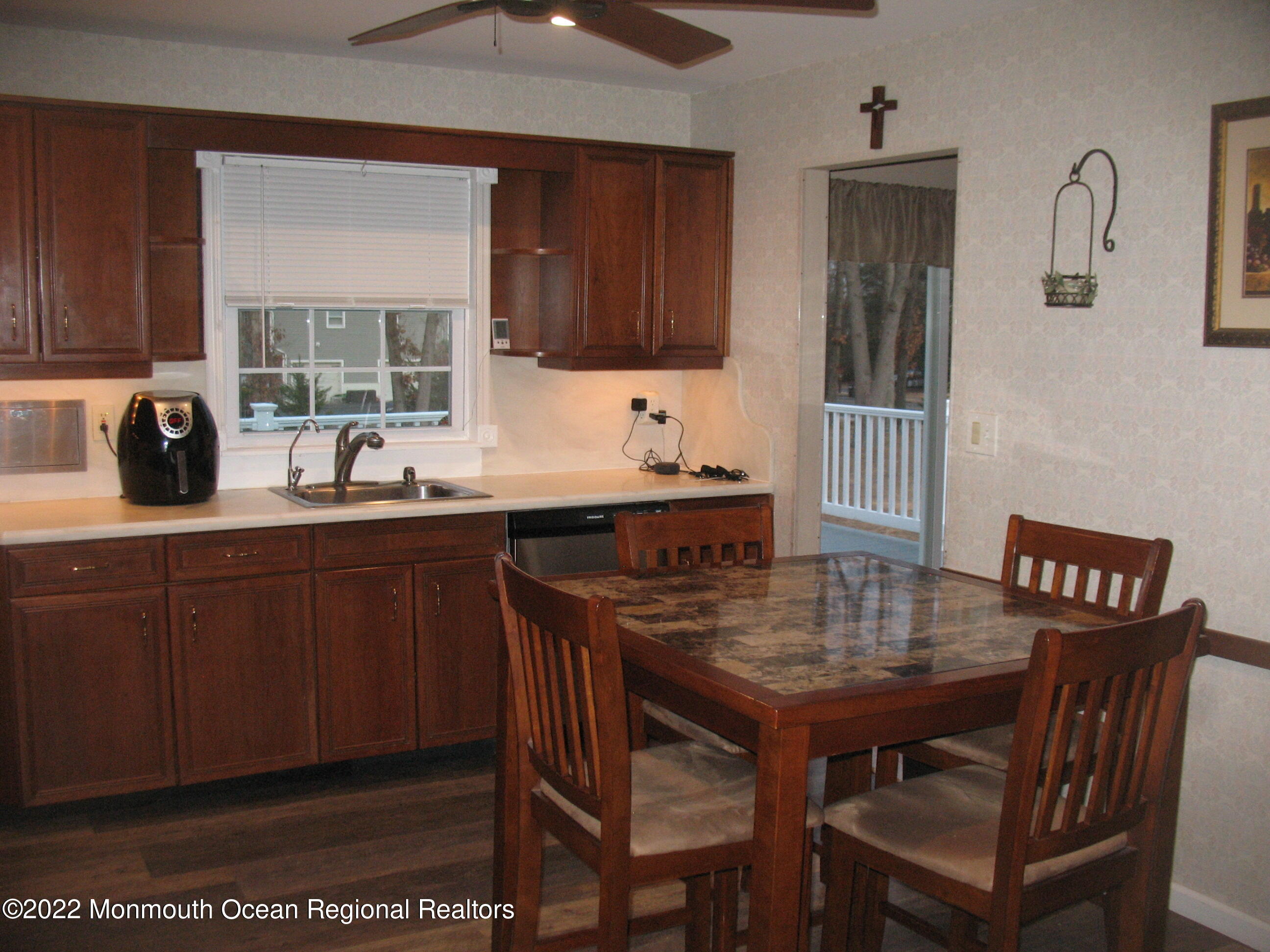 2 Godell Drive Howell, NJ 07731 - Photo 14 of 35 a kitchen with a wooden table and chairs