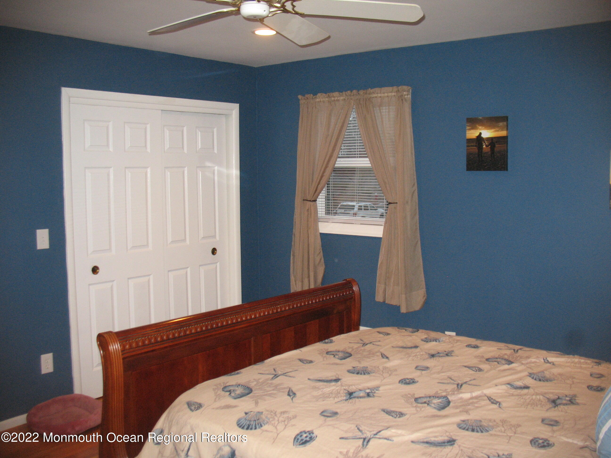 2 Godell Drive Howell, NJ 07731 - Photo 18 of 35 a bedroom with a bed and a chandelier