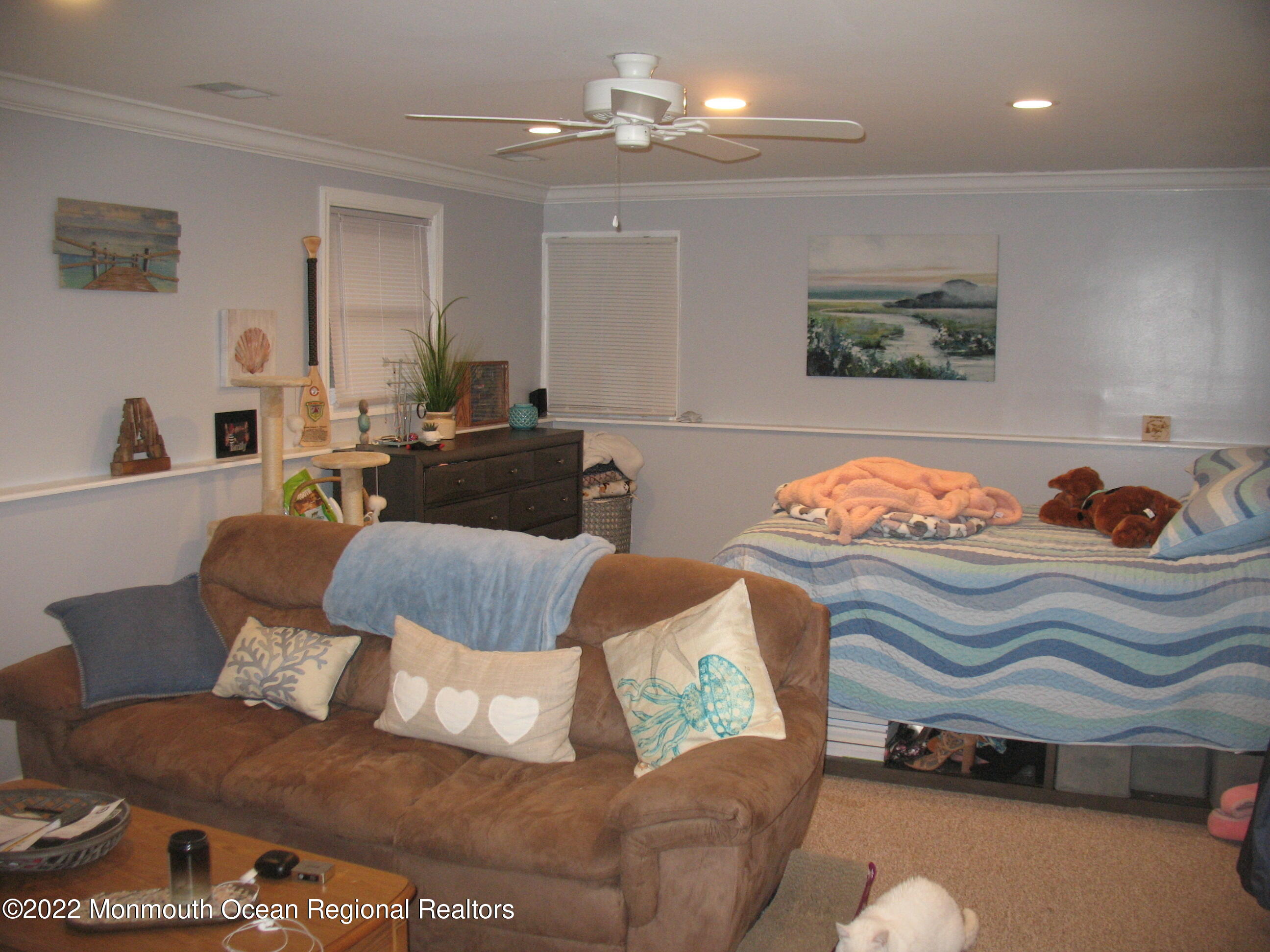 2 Godell Drive Howell, NJ 07731 - Photo 24 of 35 a living room with furniture and a chandelier