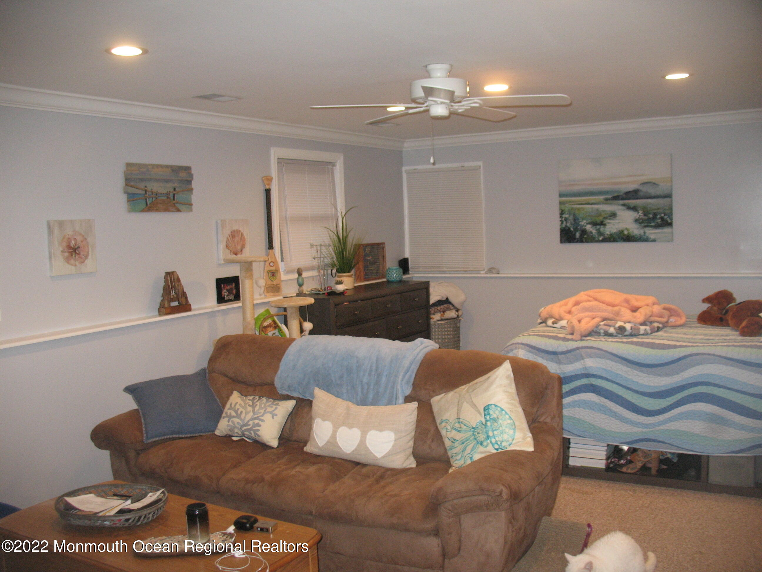 2 Godell Drive Howell, NJ 07731 - Photo 25 of 35 a living room with furniture and a chandelier