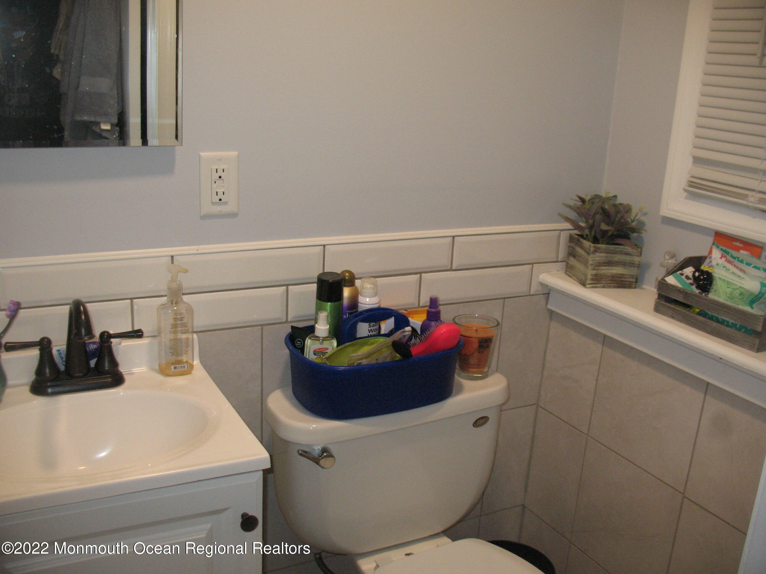 2 Godell Drive Howell, NJ 07731 - Photo 27 of 35 a bathroom with a sink and a mirror