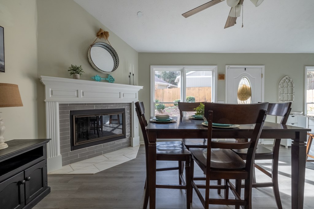 140 Maplebrook Court Columbus, GA 31904 - Photo 11 of 29 a view of a dining room with furniture and a fireplace