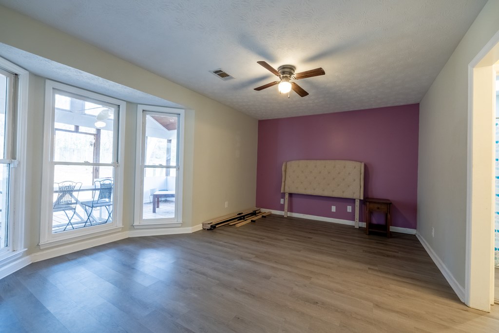 140 Maplebrook Court Columbus, GA 31904 - Photo 13 of 29 a view of room with window ceiling fan and hardwood floor