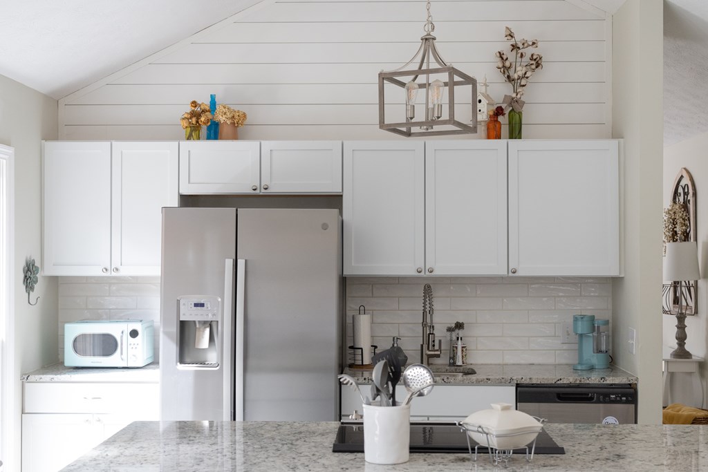 140 Maplebrook Court Columbus, GA 31904 - Photo 2 of 29 a kitchen with a refrigerator and cabinets