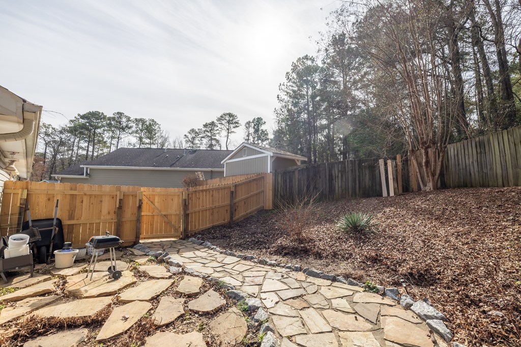 140 Maplebrook Court Columbus, GA 31904 - Photo 27 of 29 a view of a backyard with large trees