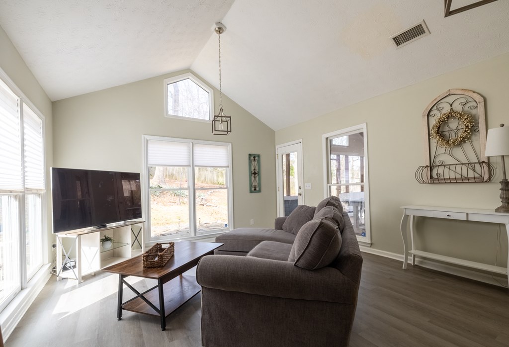 140 Maplebrook Court Columbus, GA 31904 - Photo 7 of 29 a living room with furniture a flat screen tv and a window