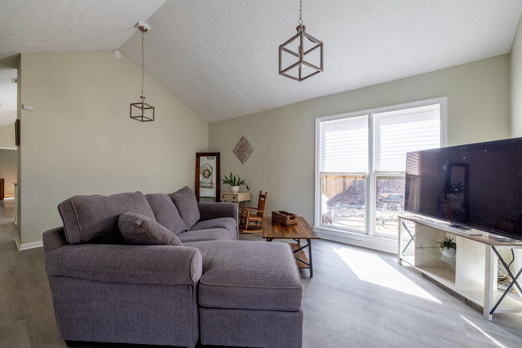 140 Maplebrook Court Columbus, GA 31904 - Photo 8 of 29 a living room with furniture and a flat screen tv