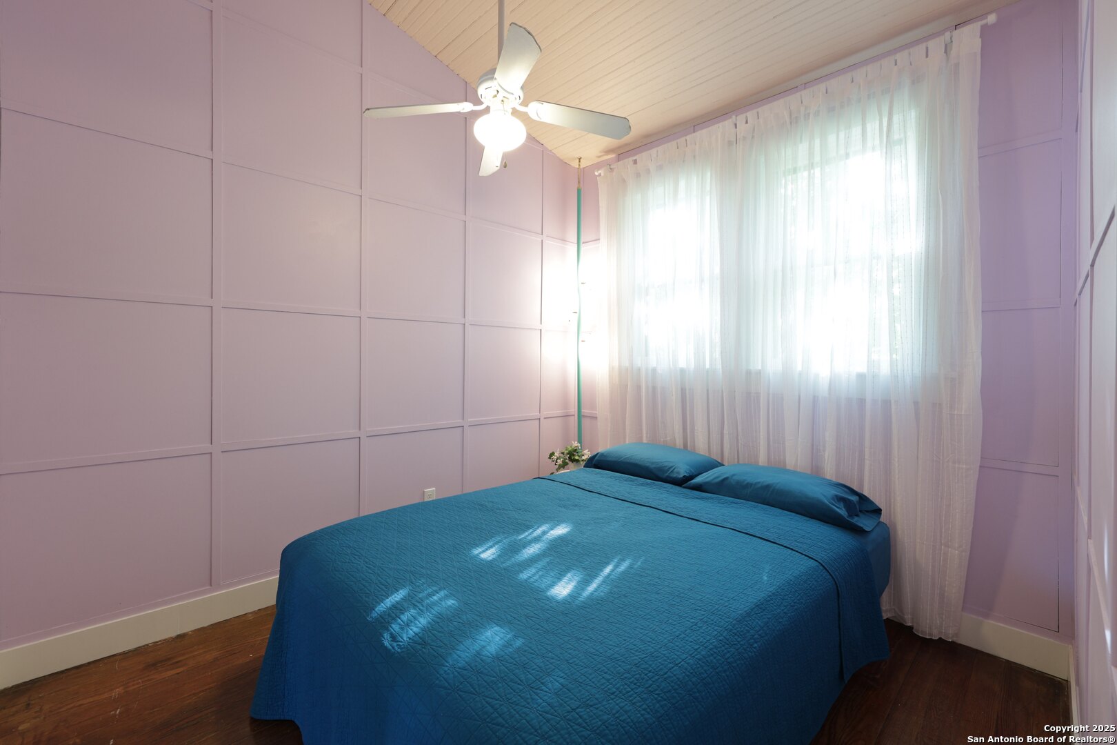 410 Riddle Street San Antonio, TX 78210 - Photo 14 of 22 a bedroom with a bed and a chandelier fan