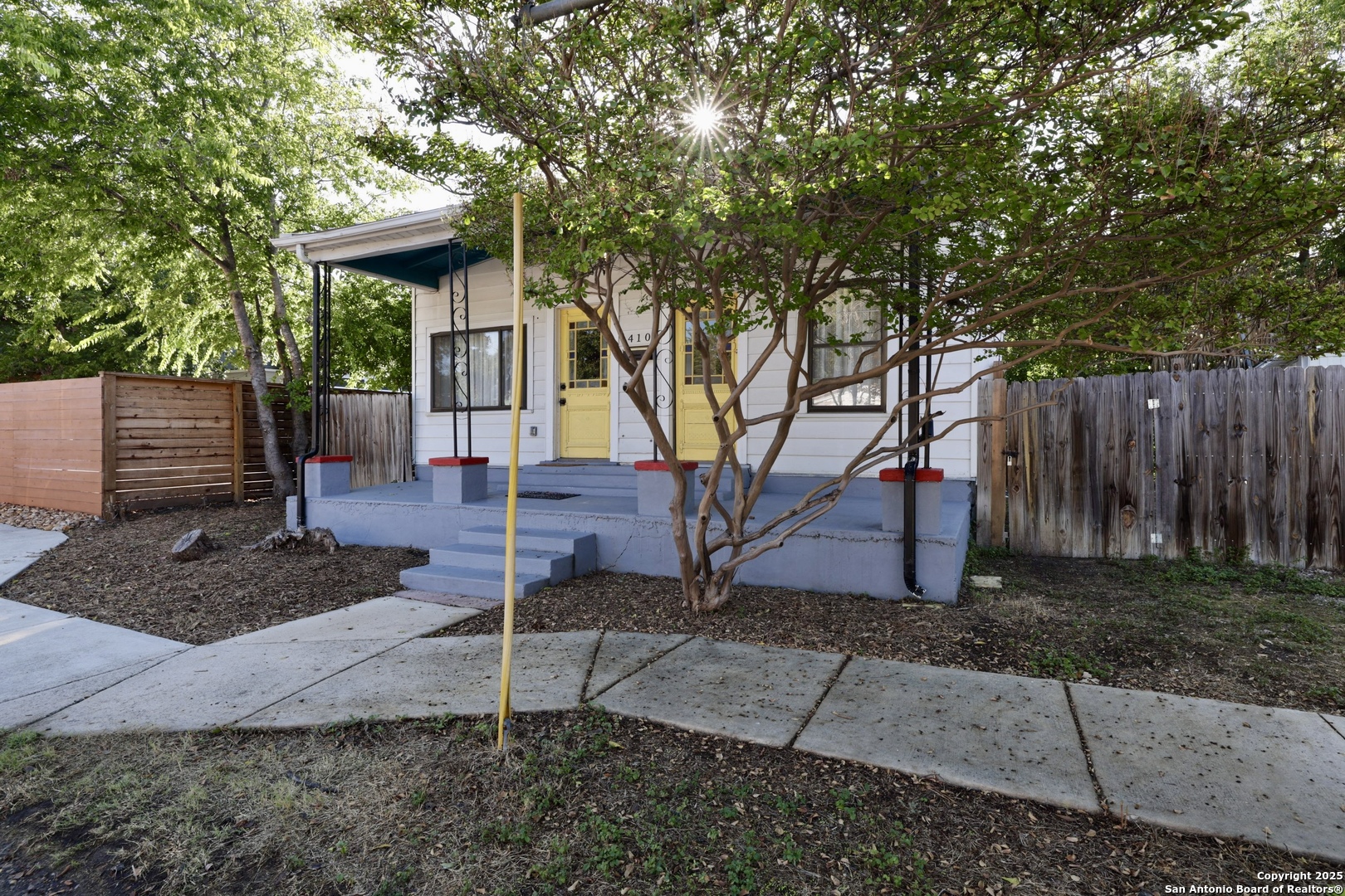 410 Riddle Street San Antonio, TX 78210 - Photo 2 of 22 a front view of a house with garden