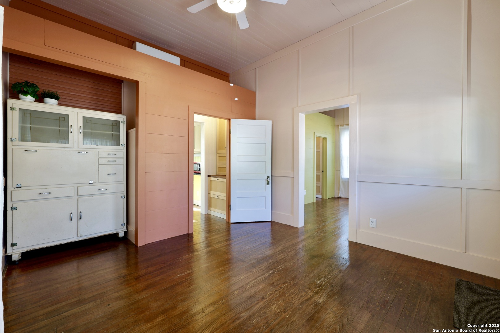 410 Riddle Street San Antonio, TX 78210 - Photo 6 of 22 an empty room with wooden floor and closet