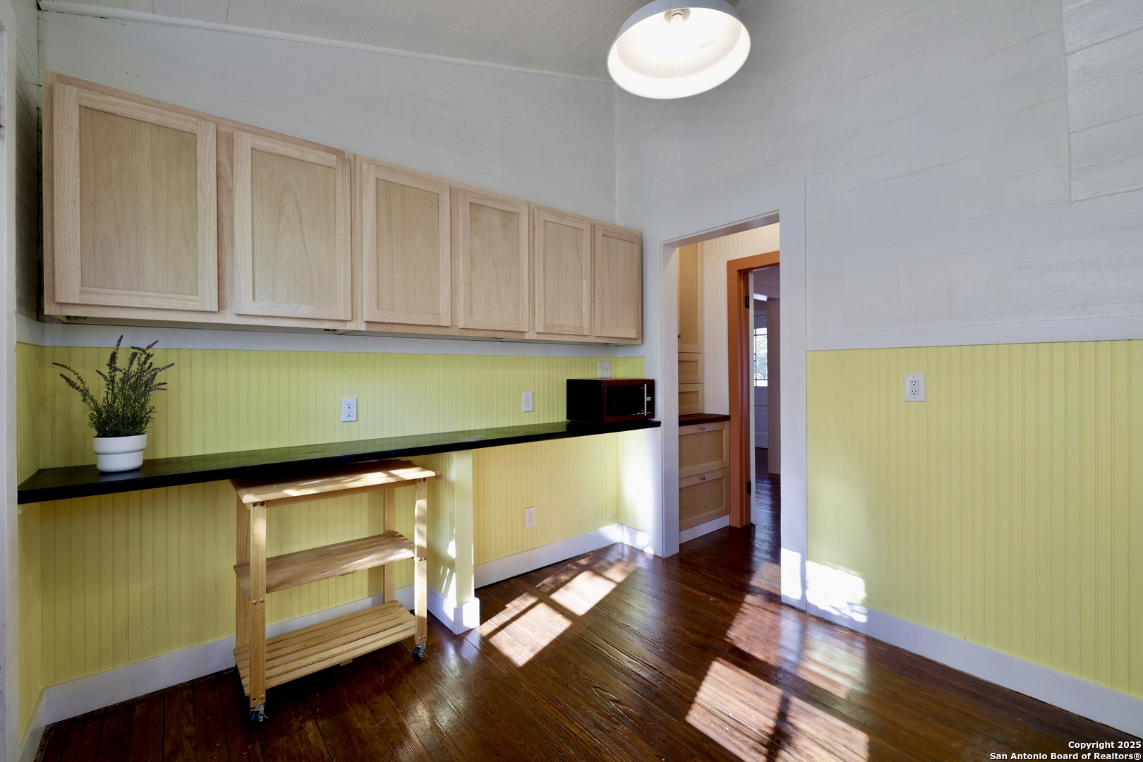 410 Riddle Street San Antonio, TX 78210 - Photo 10 of 22 a view of room with window and wooden floor
