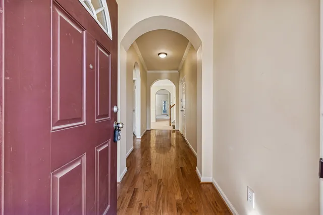 a view of gallery with wooden floor