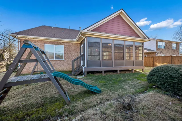 a view of tall trees with a park