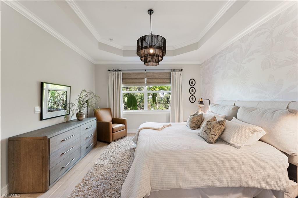 394 Deauville Loop Naples, FL 34114 - Photo 18 of 50 a bedroom with bed and a window