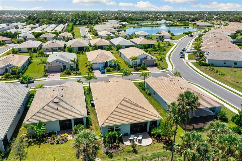 394 Deauville Loop Naples, FL 34114 - Photo 30 of 50 an aerial view of multiple house