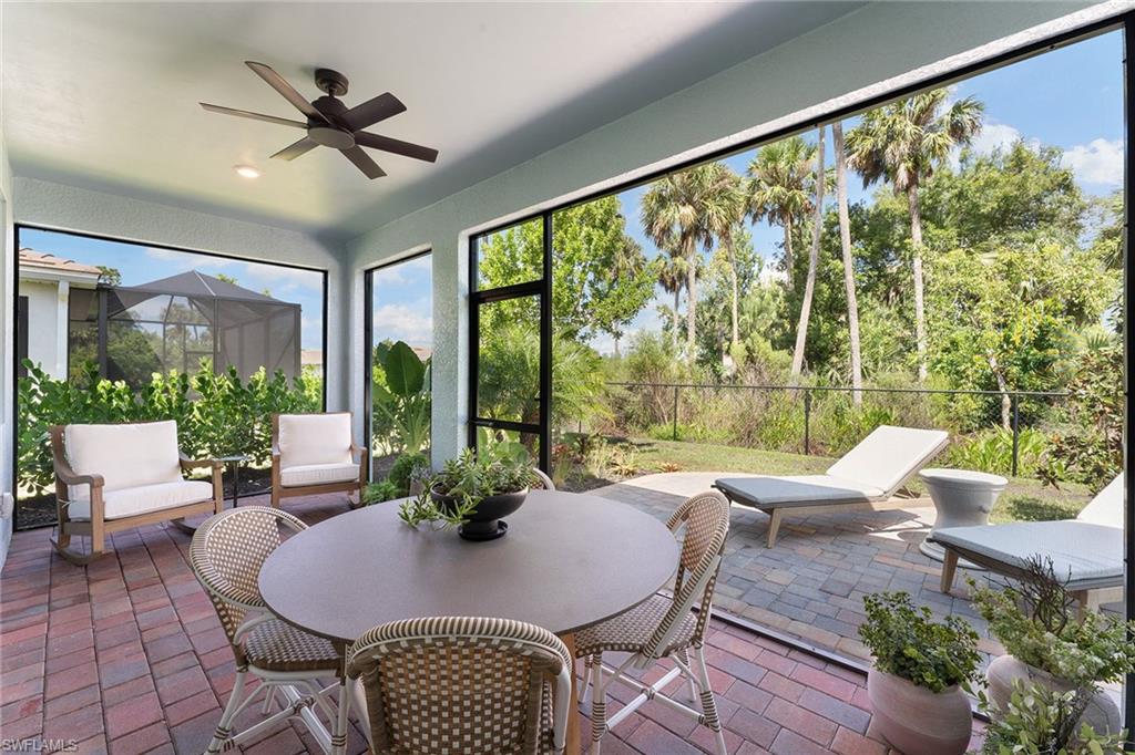 394 Deauville Loop Naples, FL 34114 - Photo 3 of 50 a living room with furniture and a large window