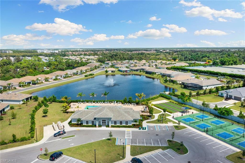 394 Deauville Loop Naples, FL 34114 - Photo 31 of 50 an aerial view of residential houses with outdoor space
