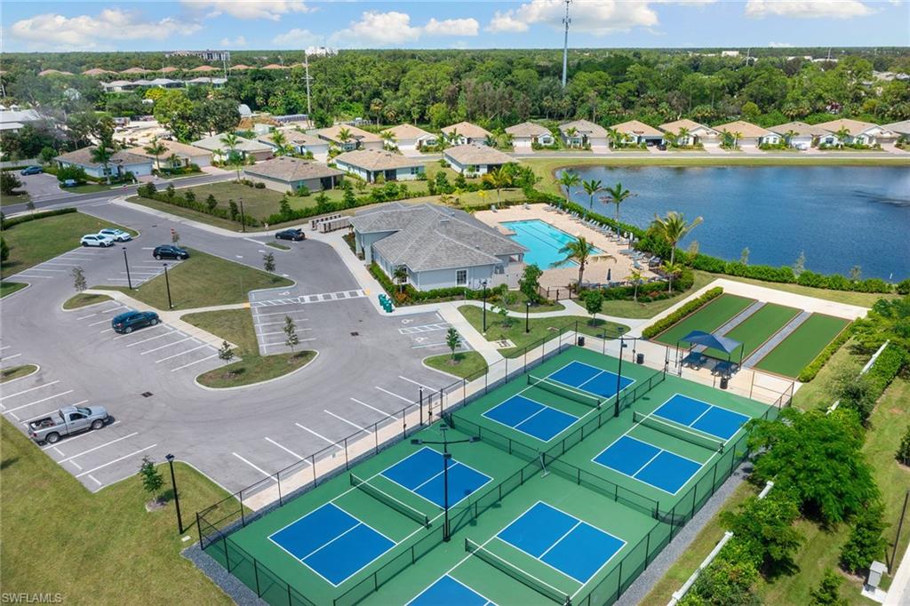 394 Deauville Loop Naples, FL 34114 - Photo 34 of 50 an aerial view of a house with a ocean view
